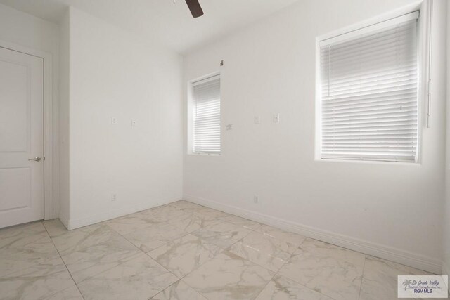 110 E Retama St, South Padre Island, TX 78597 - unfurnished room with marble finish floors and ceiling fan