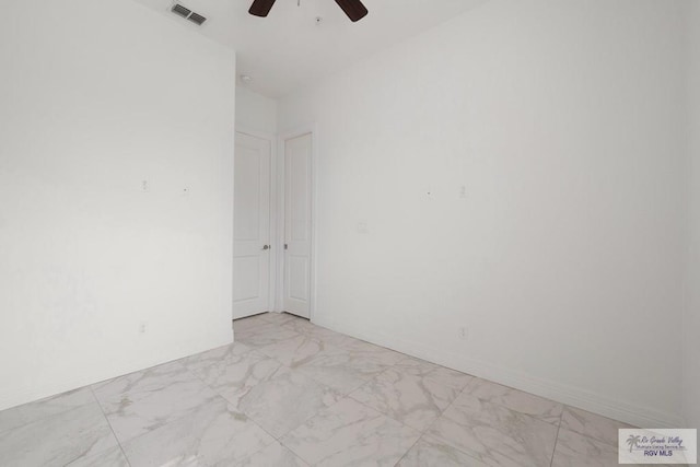 110 E Retama St, South Padre Island, TX 78597 - empty room with ceiling fan and light marble finish floors