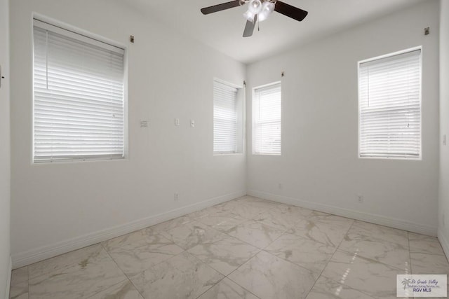 110 E Retama St, South Padre Island, TX 78597 - spare room featuring ceiling fan and marble look tile flooring