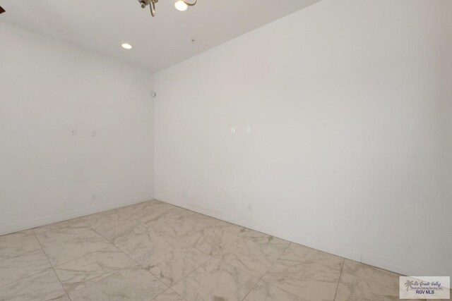 110 E Retama St, South Padre Island, TX 78597 - empty room with recessed lighting, a chandelier, and light marble finish floors