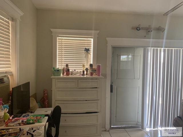 35 Yucatan Ct, Brownsville, TX 78526 - bedroom featuring light tile patterned flooring and an office area
