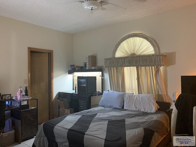 35 Yucatan Ct, Brownsville, TX 78526 - bedroom featuring a textured ceiling and multiple windows