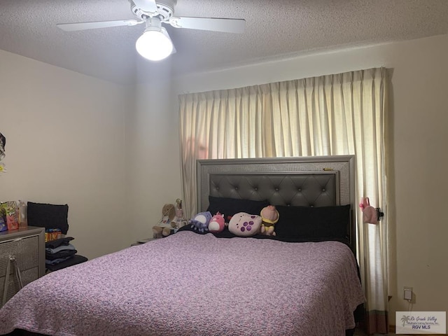 35 Yucatan Ct, Brownsville, TX 78526 - bedroom featuring a ceiling fan and a textured ceiling