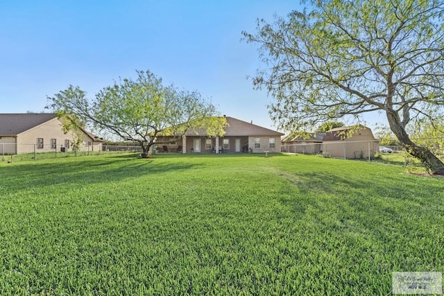 view of yard with a fenced backyard