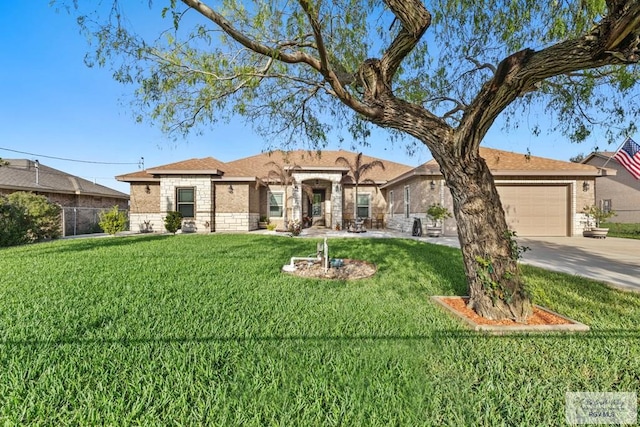 view of front of property featuring a front lawn, stone siding, driveway, and an attached garage