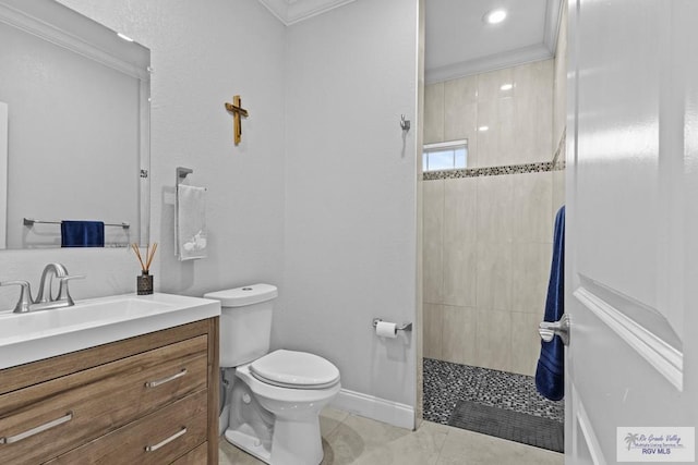 bathroom with a walk in shower, tile patterned flooring, toilet, vanity, and crown molding