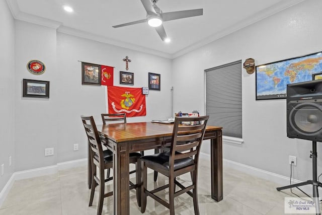 dining space with light tile patterned floors, ornamental molding, and baseboards