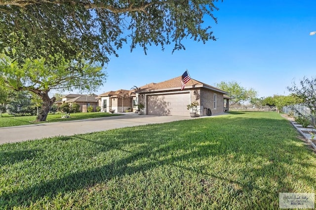 view of front facade with an attached garage, a front lawn, and concrete driveway