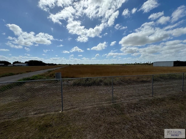 view of yard with a rural view