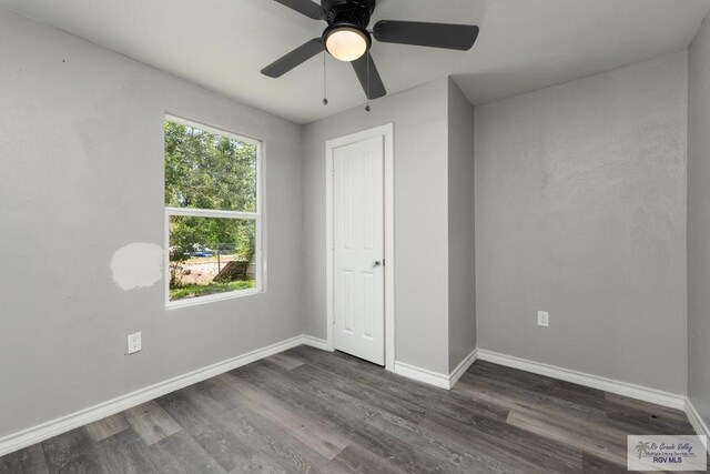 136 Garden St, Brownsville, TX 78520 - unfurnished bedroom with dark wood-type flooring, baseboards, and ceiling fan