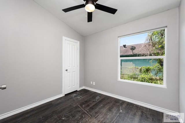 136 Garden St, Brownsville, TX 78520 - spare room with dark wood-type flooring, baseboards, lofted ceiling, and a ceiling fan