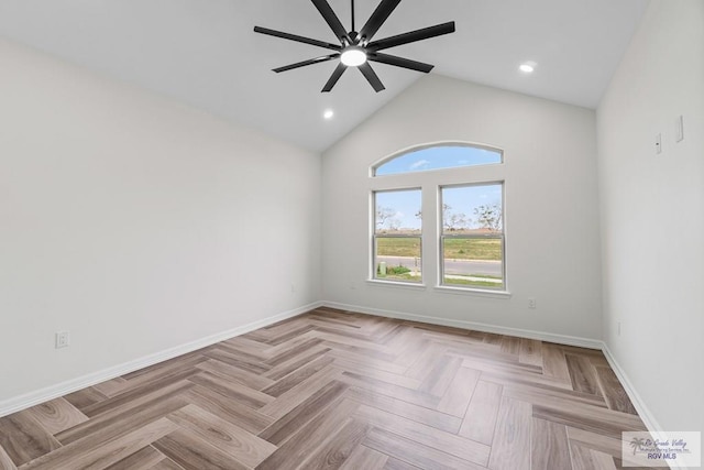 spare room with ceiling fan, light parquet flooring, and high vaulted ceiling