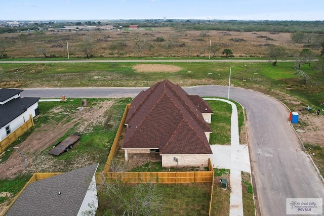 birds eye view of property with a rural view