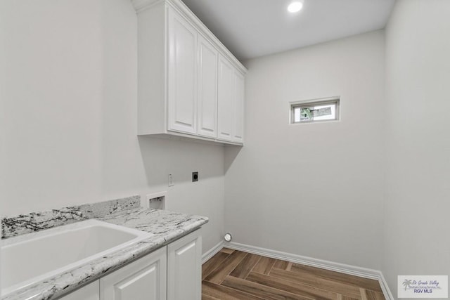 laundry room with sink, cabinets, washer hookup, dark parquet floors, and hookup for an electric dryer