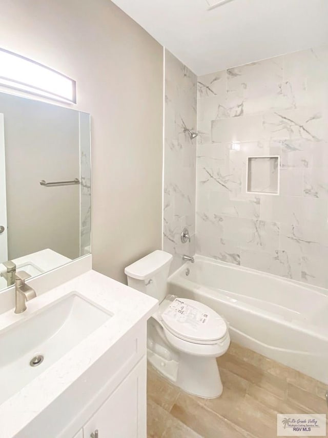 full bathroom featuring shower / bathtub combination, vanity, toilet, and wood finished floors