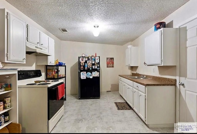 kitchen featuring white range with electric cooktop, white cabinetry, black refrigerator, and sink