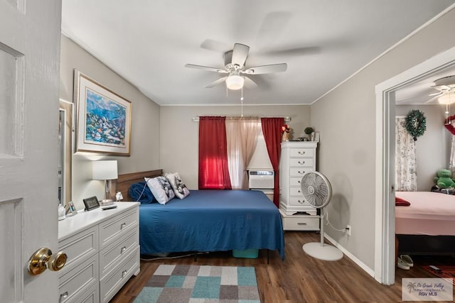 bedroom featuring ceiling fan and dark hardwood / wood-style floors