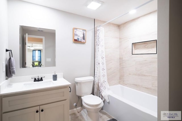 full bathroom featuring vanity, toilet, and shower / tub combo with curtain