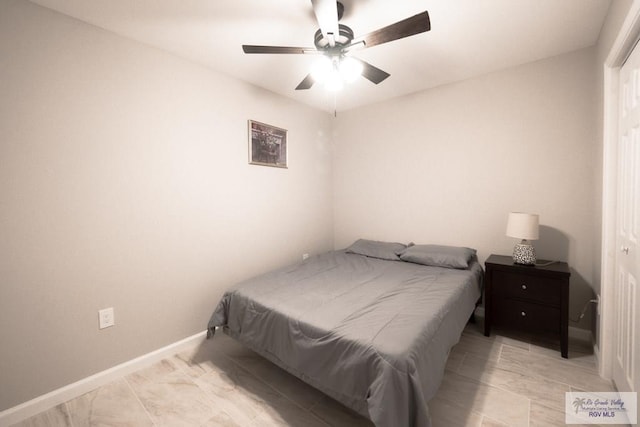 bedroom with baseboards and ceiling fan