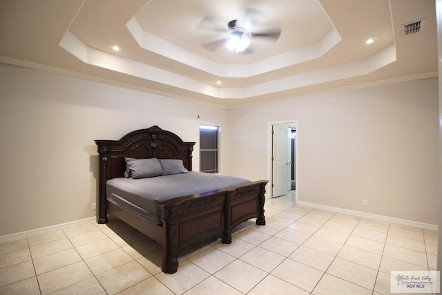 tiled bedroom featuring a tray ceiling, ceiling fan, and crown molding