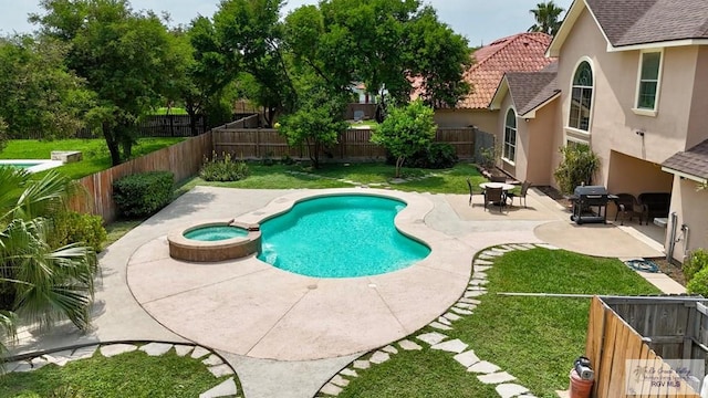 view of swimming pool with a pool with connected hot tub, a grill, a fenced backyard, a lawn, and a patio area
