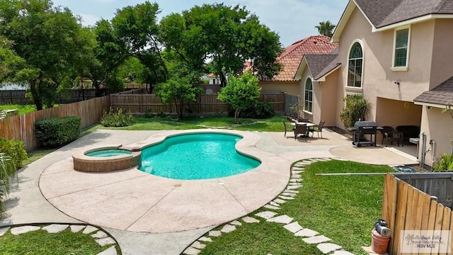 view of swimming pool with area for grilling, a pool with connected hot tub, a yard, a fenced backyard, and a patio