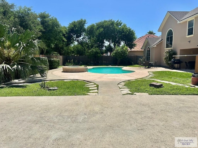 view of pool featuring a fenced backyard, a fenced in pool, a patio, and grilling area