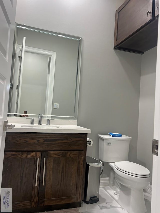 27360 Prudencia St Unit 16, Brownsville, TX 78521 - half bath with toilet, vanity, and marble look tiles