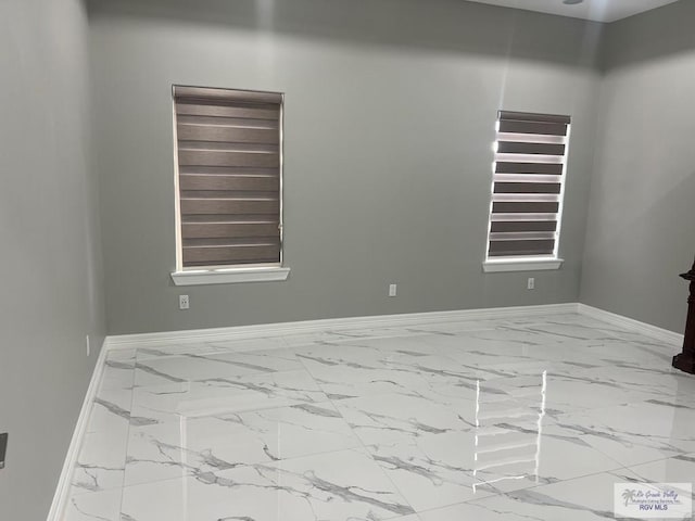 27360 Prudencia St Unit 16, Brownsville, TX 78521 - unfurnished room with marble finish flooring and baseboards