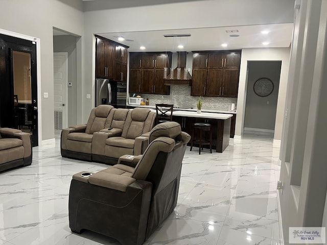 27360 Prudencia St Unit 16, Brownsville, TX 78521 - living room with light marble finish floors, baseboards, and recessed lighting