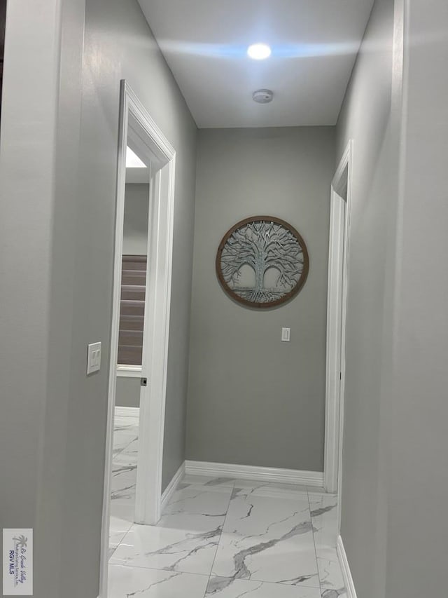 27360 Prudencia St Unit 16, Brownsville, TX 78521 - hallway with light marble finish flooring and baseboards