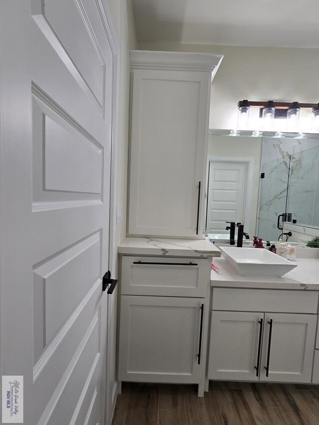 doorway featuring ceiling fan and light hardwood / wood-style flooring