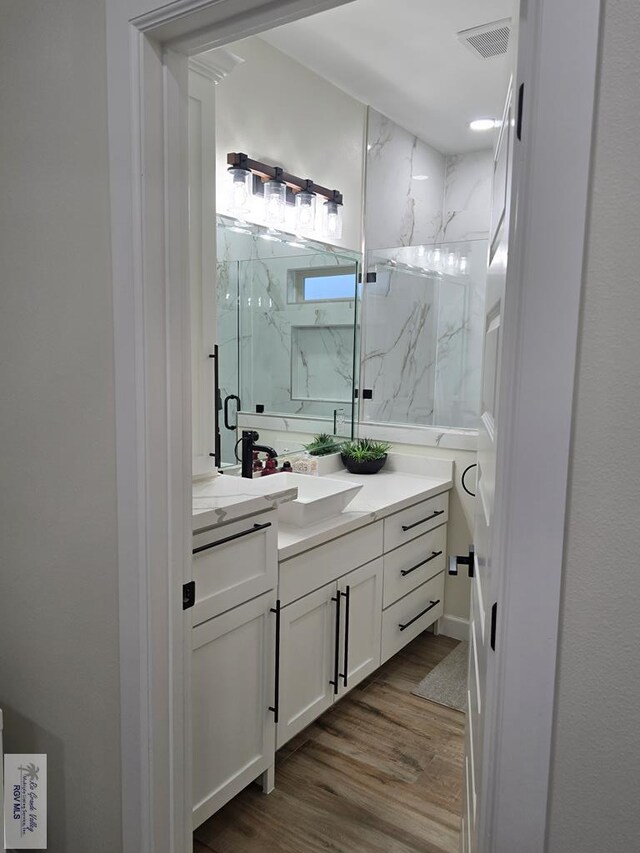 bathroom with wood-type flooring and toilet