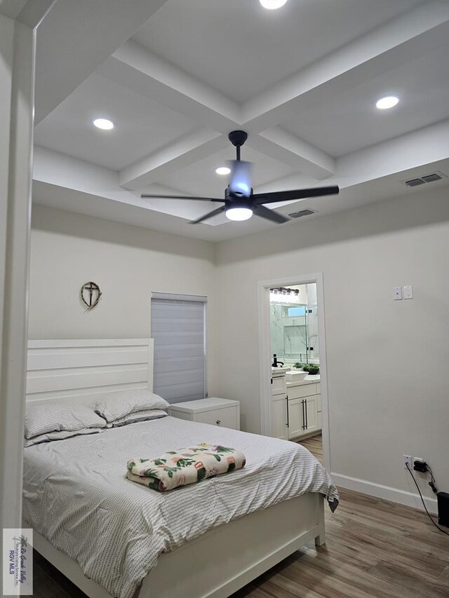 bathroom featuring hardwood / wood-style floors and toilet