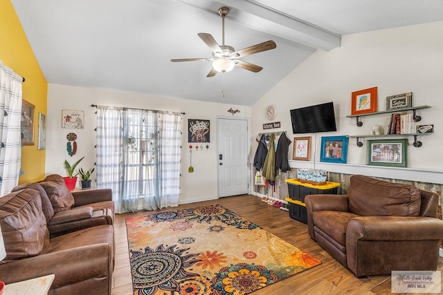 living room featuring hardwood / wood-style flooring, ceiling fan, and lofted ceiling with beams