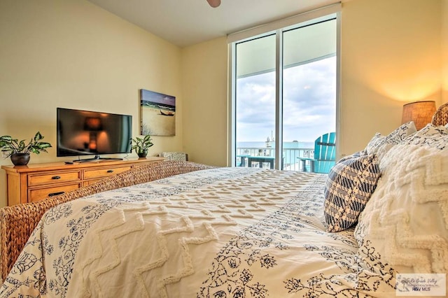 310 Padre Blvd Unit 1402, South Padre Island, TX 78597 - bedroom with access to outside and expansive windows