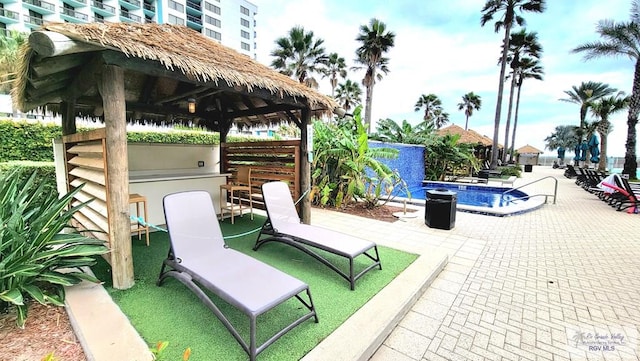 310 Padre Blvd Unit 1402, South Padre Island, TX 78597 - view of patio / terrace featuring a gazebo and a community pool