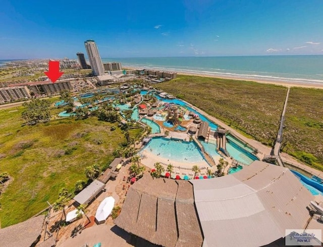 bird's eye view with a water view and a view of the beach