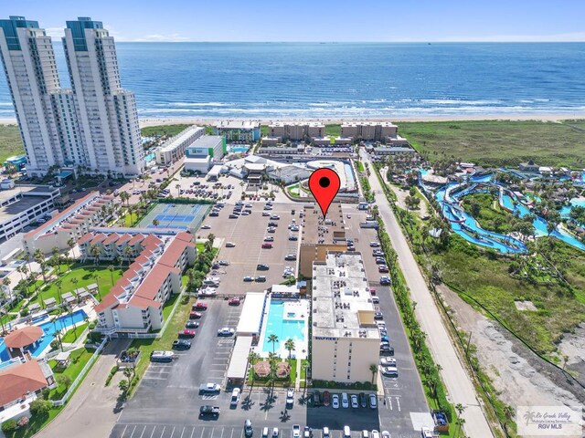 bird's eye view featuring a view of the beach and a water view