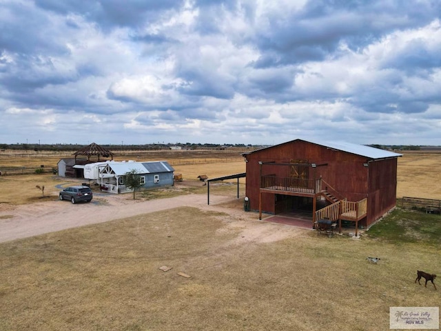 view of outbuilding with a rural view