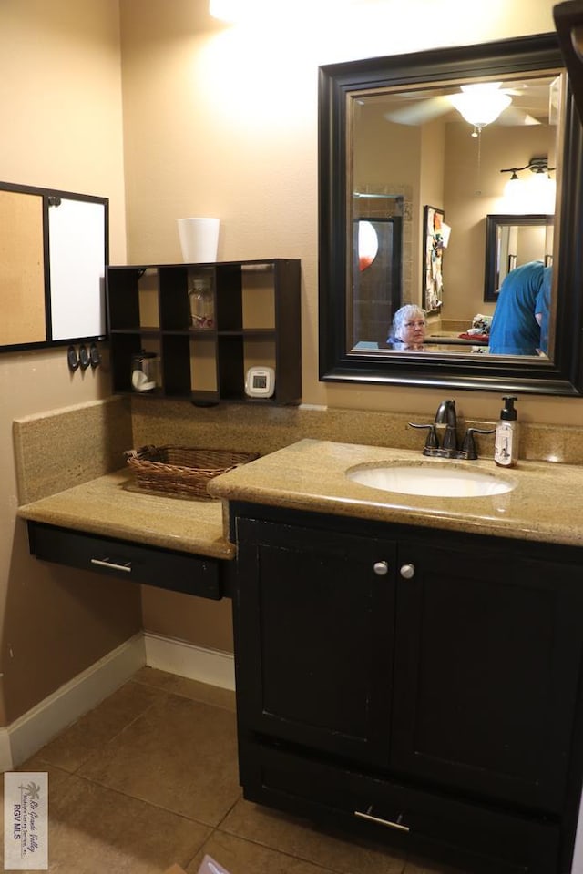 bathroom with tile patterned flooring and vanity