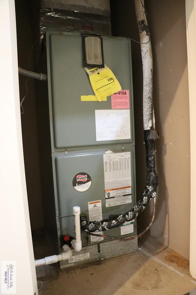 utility room with heating unit