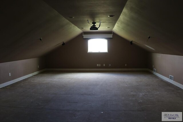 bonus room with vaulted ceiling