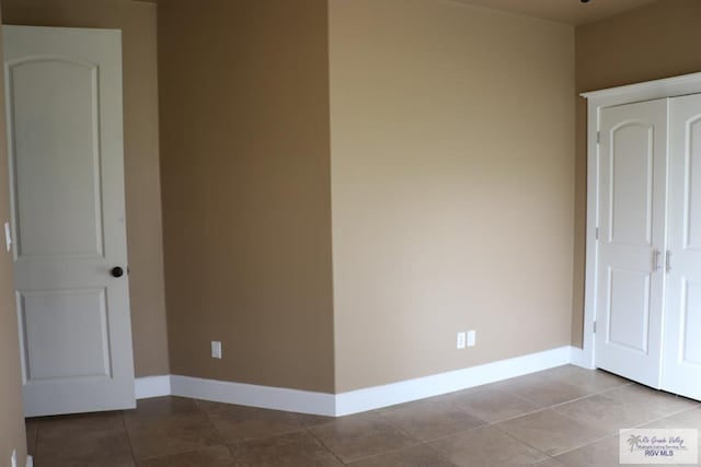 unfurnished bedroom featuring light tile patterned floors