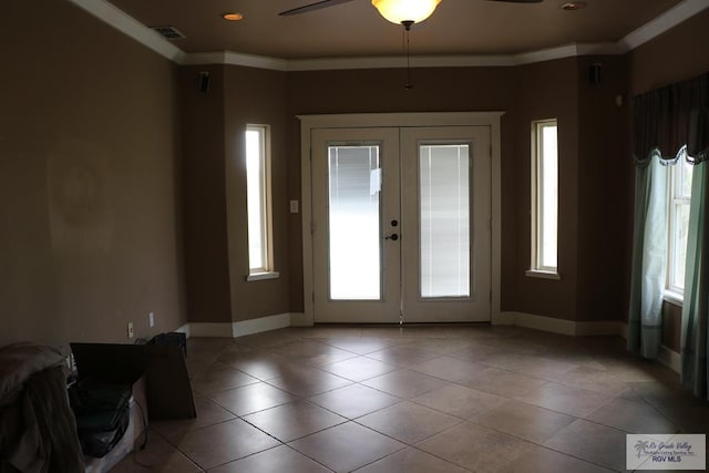 interior space featuring ceiling fan, french doors, light tile patterned floors, and ornamental molding