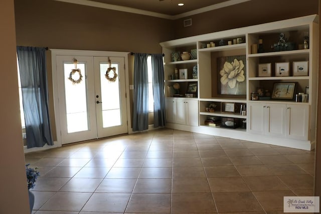 interior space with french doors, tile patterned floors, and plenty of natural light