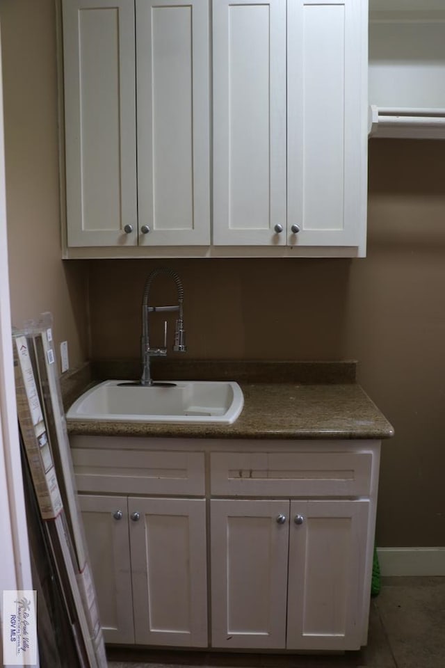 kitchen with white cabinets and sink