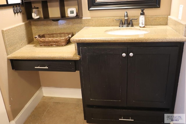 bathroom featuring sink and tile patterned flooring