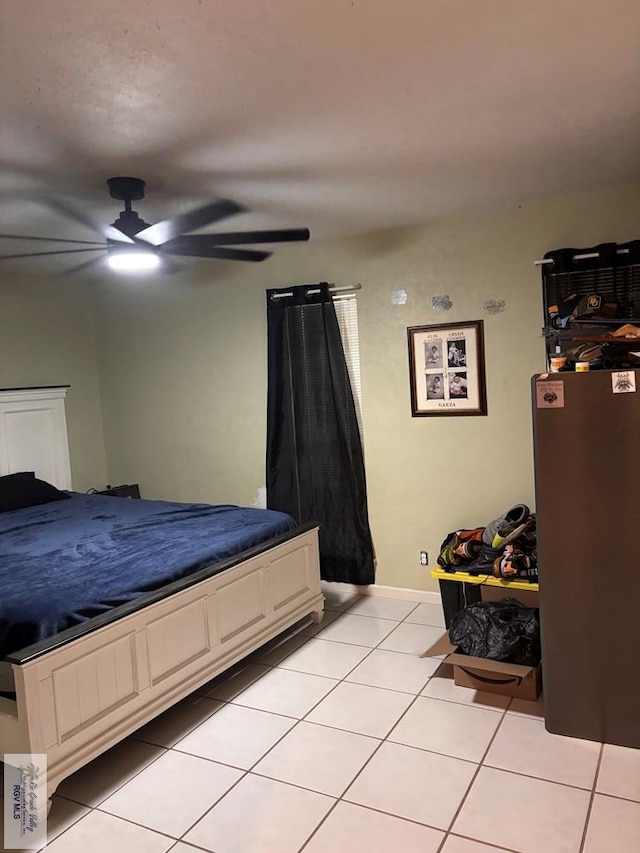 bedroom with a ceiling fan and light tile patterned flooring