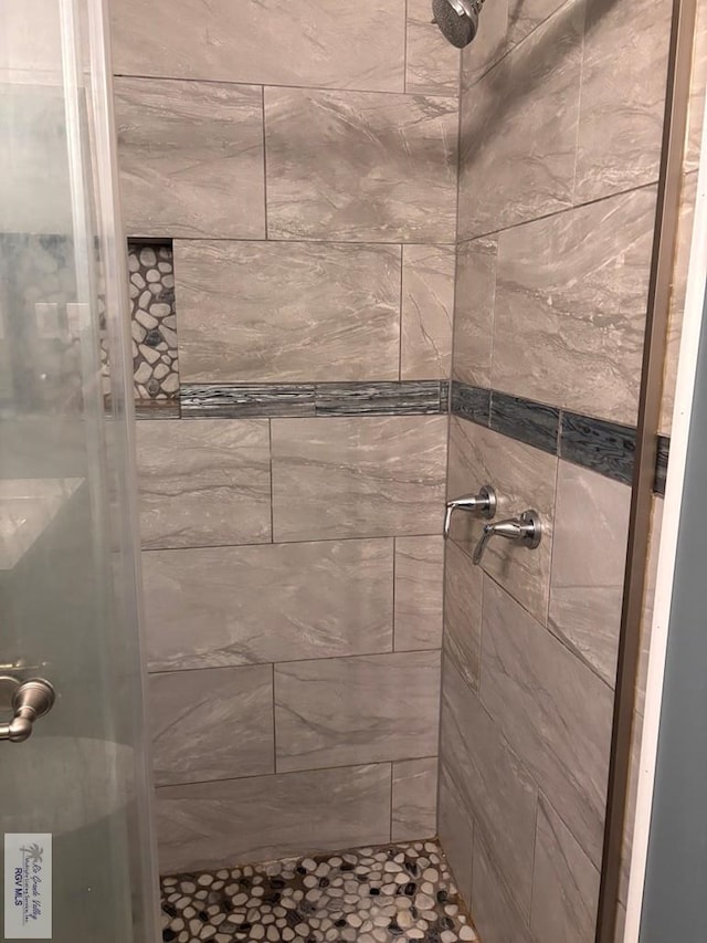 bathroom with a stall shower